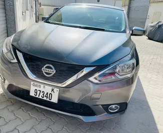 Frontvisning av en leiebil Nissan Sentra i Dubai, De Forente Arabiske Emirater ✓ Bil #7113. ✓ Automatisk TM ✓ 0 anmeldelser.