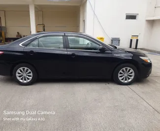 Toyota Camry 2015 car hire in Georgia, featuring ✓ Hybrid fuel and 200 horsepower ➤ Starting from 100 GEL per day.