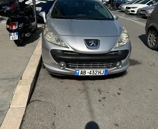 Front view of a rental Peugeot 207cc in Durres, Albania ✓ Car #7314. ✓ Manual TM ✓ 0 reviews.