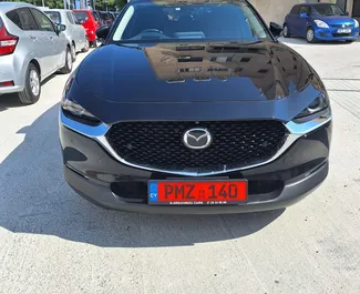 Front view of a rental Mazda CX-30 in Limassol, Cyprus ✓ Car #7233. ✓ Automatic TM ✓ 0 reviews.