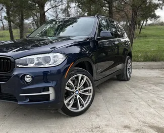 BMW X5 2014 car hire in Georgia, featuring ✓ Petrol fuel and 306 horsepower ➤ Starting from 273 GEL per day.