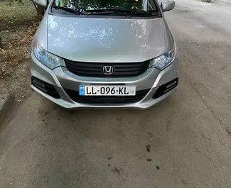 Front view of a rental Honda Insight in Tbilisi, Georgia ✓ Car #7383. ✓ Automatic TM ✓ 0 reviews.