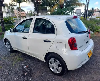 Front view of a rental Nissan March at Mauritius Airport, Mauritius ✓ Car #7332. ✓ Automatic TM ✓ 0 reviews.