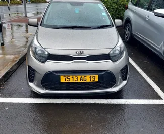 Front view of a rental Kia Picanto at Mauritius Airport, Mauritius ✓ Car #7328. ✓ Automatic TM ✓ 1 reviews.