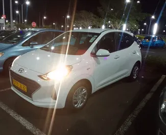 Front view of a rental Hyundai i10 at Mauritius Airport, Mauritius ✓ Car #7371. ✓ Automatic TM ✓ 0 reviews.