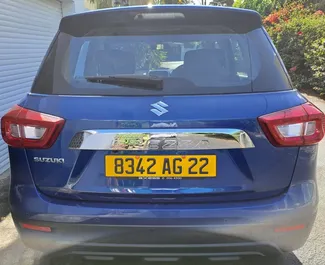 Front view of a rental Suzuki Vitara Brezza at Mauritius Airport, Mauritius ✓ Car #7380. ✓ Automatic TM ✓ 0 reviews.