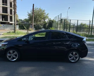 Hybrid 1.8L engine of Toyota Prius 2013 for rental in Kutaisi.