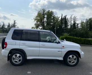 Car Hire Mitsubishi Pajero Io #7774 Automatic in Kutaisi, equipped with 2.0L engine ➤ From Dima in Georgia.