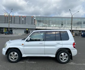 Mitsubishi Pajero Io 2005 car hire in Georgia, featuring ✓ Petrol fuel and 180 horsepower ➤ Starting from 90 GEL per day.