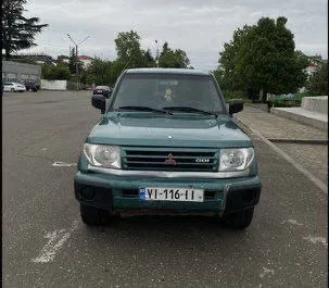 Front view of a rental Mitsubishi Pajero Io in Kutaisi, Georgia ✓ Car #7748. ✓ Automatic TM ✓ 1 reviews.