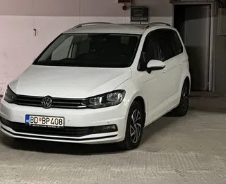 Front view of a rental Volkswagen Touran in Becici, Montenegro ✓ Car #7902. ✓ Automatic TM ✓ 0 reviews.