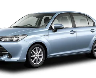 Frontvisning av en leiebil Toyota Corolla Axio på Mauritius lufthavn, Mauritius ✓ Bil #7660. ✓ Automatisk TM ✓ 0 anmeldelser.