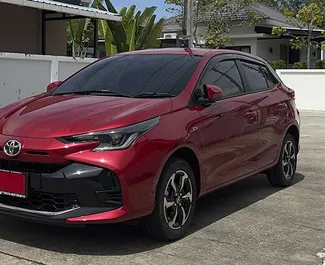 Front view of a rental Toyota Yaris at Phuket Airport, Thailand ✓ Car #8138. ✓ Automatic TM ✓ 0 reviews.