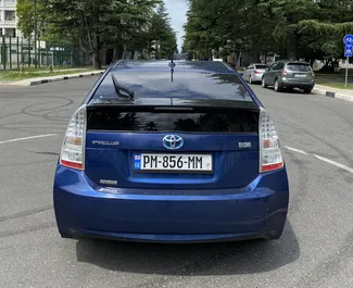 Interiøret til Toyota Prius til leie i Georgia. En flott 5-seters bil med Automatisk-gir.