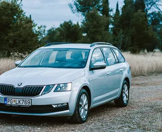 Vista frontal de un Skoda Octavia Combi de alquiler en Podgorica, Montenegro ✓ Coche n.º 7360. ✓ Automático TM ✓ 0 opiniones.