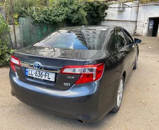 Petrol 1.6L engine of Toyota Camry 2013 for rental in Tbilisi.