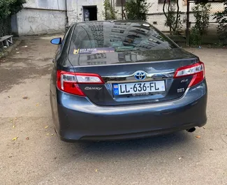 Toyota Camry 2013 available for rent in Tbilisi, with unlimited mileage limit.