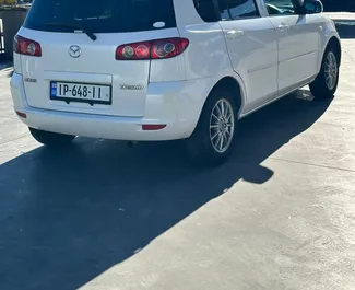 Front view of a rental Mazda Demio in Tbilisi, Georgia ✓ Car #8112. ✓ Automatic TM ✓ 0 reviews.