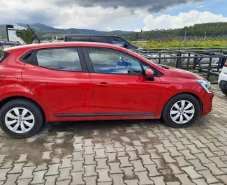 Front view of a rental Renault Clio 5 at Bodrum Airport, Turkey ✓ Car #8050. ✓ Automatic TM ✓ 0 reviews.