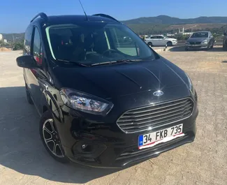 Front view of a rental Ford Courier at Bodrum Airport, Turkey ✓ Car #7885. ✓ Manual TM ✓ 0 reviews.