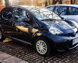 Front view of a rental Toyota Aygo at Belgrade Airport, Serbia ✓ Car #8367. ✓ Automatic TM ✓ 2 reviews.