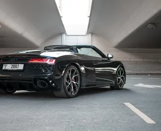 Audi R8 Cabrio 2021 car hire in the UAE, featuring ✓ Petrol fuel and 562 horsepower ➤ Starting from 1860 AED per day.