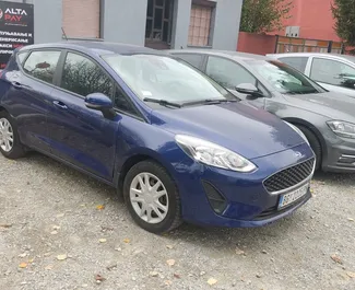 Front view of a rental Ford Fiesta Ecoboost at Belgrade Airport, Serbia ✓ Car #8249. ✓ Manual TM ✓ 0 reviews.