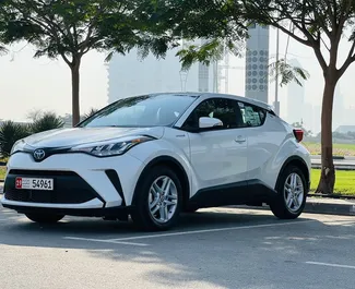 Toyota C-HR Hybrid 2023 car hire in the UAE, featuring ✓ Petrol fuel and 160 horsepower ➤ Starting from 110 AED per day.