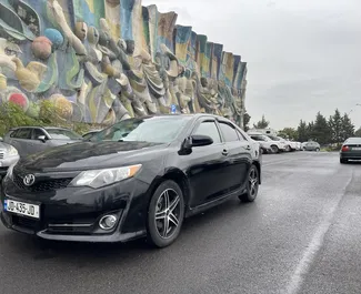 Front view of a rental Toyota Camry at Tbilisi Airport, Georgia ✓ Car #8349. ✓ Automatic TM ✓ 0 reviews.