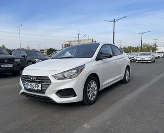 Front view of a rental Hyundai Accent at Tbilisi Airport, Georgia ✓ Car #8348. ✓ Automatic TM ✓ 0 reviews.