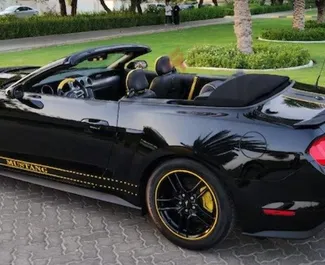 Ford Mustang Cabrio 2022 car hire in the UAE, featuring ✓ Petrol fuel and 400 horsepower ➤ Starting from 350 AED per day.