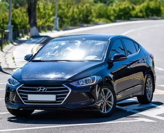 Predný pohľad na prenajaté auto Hyundai Elantra v v Jerevane, Arménsko ✓ Auto č. 9066. ✓ Prevodovka Automatické TM ✓ Hodnotenia 0.