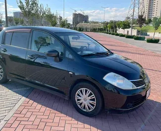 Petrol 1.5L engine of Nissan Tiida 2007 for rental in Yerevan.