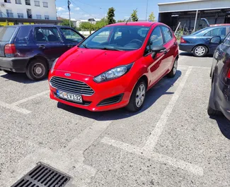 Front view of a rental Ford Fiesta in Podgorica, Montenegro ✓ Car #9313. ✓ Manual TM ✓ 0 reviews.