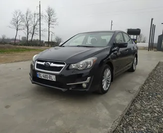 Predný pohľad na prenajaté auto Subaru Impreza v na letisku Kutaisi, Georgia ✓ Auto č. 9231. ✓ Prevodovka Automatické TM ✓ Hodnotenia 0.