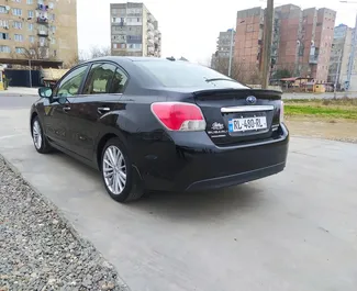 Petrol 2.0L engine of Subaru Impreza 2016 for rental at Kutaisi Airport.