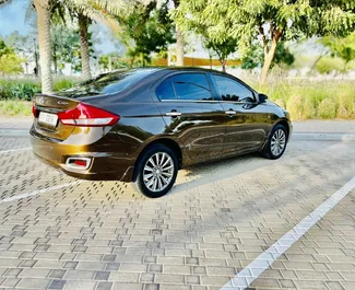 Auton vuokraus Suzuki Ciaz #9130 Automaattinen Dubain Al Maktoumin lentoasemalla, varustettuna 1,5L moottorilla ➤ Mikaelltä Arabiemiirikunnissa.