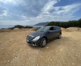 Front view of a rental Mercedes-Benz R-Class at Tirana airport, Albania ✓ Car #9371. ✓ Automatic TM ✓ 0 reviews.