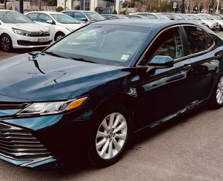 Front view of a rental Toyota Camry at Tbilisi Airport, Georgia ✓ Car #9557. ✓ Automatic TM ✓ 0 reviews.