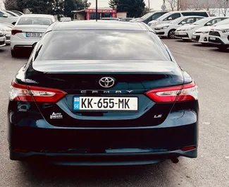 Petrol 2.5L engine of Toyota Camry 2021 for rental at Tbilisi Airport.