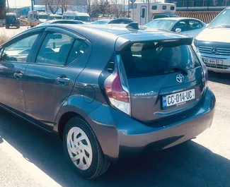 Toyota Prius C 2016 available for rent at Tbilisi Airport, with unlimited mileage limit.