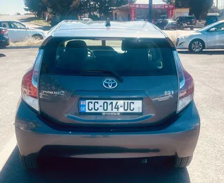 Petrol 1.5L engine of Toyota Prius C 2016 for rental at Tbilisi Airport.