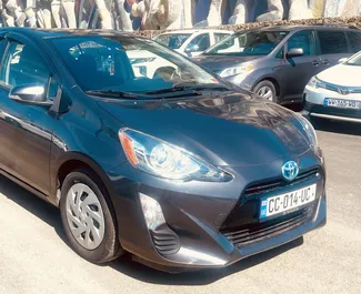 Toyota Prius C 2016 car hire in Georgia, featuring ✓ Petrol fuel and 99 horsepower ➤ Starting from 60 GEL per day.