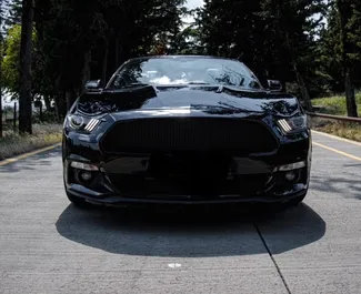 Front view of a rental Ford Mustang Cabrio in Tbilisi, Georgia ✓ Car #9486. ✓ Automatic TM ✓ 0 reviews.