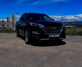 Sprednji pogled najetega avtomobila Hyundai Tucson v v Tbilisiju, Georgia ✓ Avtomobil #9591. ✓ Menjalnik Samodejno TM ✓ Mnenja 0.