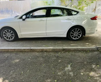 Najem avtomobila Ford Fusion Sedan 2016 v v Gruziji, z značilnostmi ✓ gorivo Bencin in 60 konjskih moči ➤ Od 162 GEL na dan.