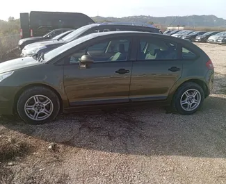 Front view of a rental Citroen C4 at Tirana airport, Albania ✓ Car #10005. ✓ Manual TM ✓ 0 reviews.