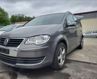 Front view of a rental Volkswagen Touran at Tirana airport, Albania ✓ Car #10084. ✓ Manual TM ✓ 1 reviews.