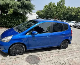 Front view of a rental Honda Jazz at Tirana airport, Albania ✓ Car #10091. ✓ Automatic TM ✓ 0 reviews.