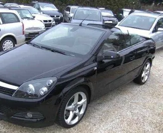 Front view of a rental Opel Astra CC at Tirana airport, Albania ✓ Car #10126. ✓ Manual TM ✓ 0 reviews.